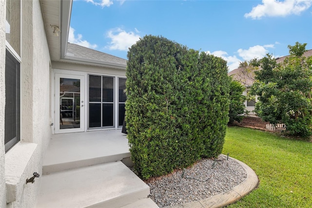 1521 Southport St, The Villages, FL 32162 - doorway to property with a lawn and stucco siding