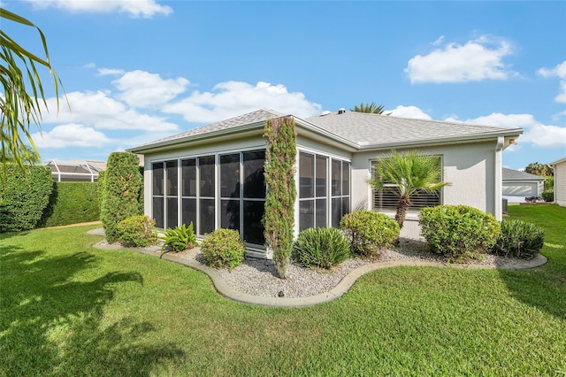 1521 Southport St, The Villages, FL 32162 - back of house with stucco siding, a yard, and a sunroom
