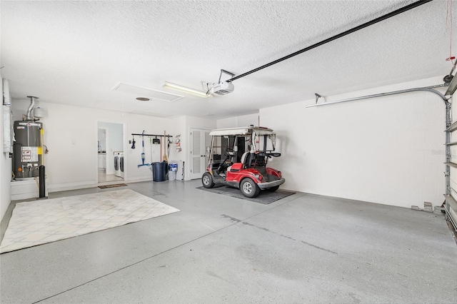 1521 Southport St, The Villages, FL 32162 - garage featuring gas water heater, washer and dryer, and a garage door opener