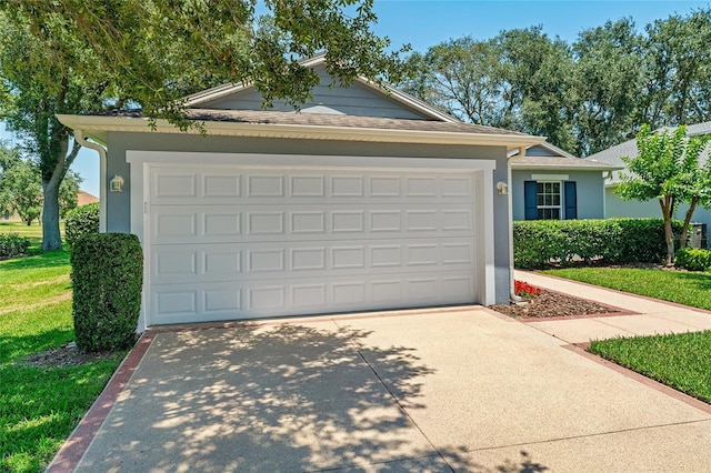 26822 Bull Run, Leesburg, FL 34748 - view of front of house with concrete driveway, stucco siding, an attached garage, and a front yard