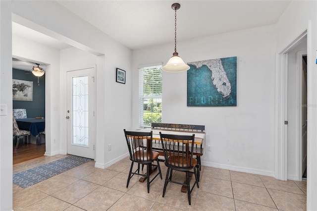 26822 Bull Run, Leesburg, FL 34748 - dining space with light tile patterned flooring, baseboards, and a ceiling fan