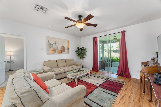 26822 Bull Run, Leesburg, FL 34748 - living room with a ceiling fan, wood finished floors, and baseboards