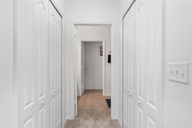 26822 Bull Run, Leesburg, FL 34748 - hallway featuring light tile patterned floors and baseboards