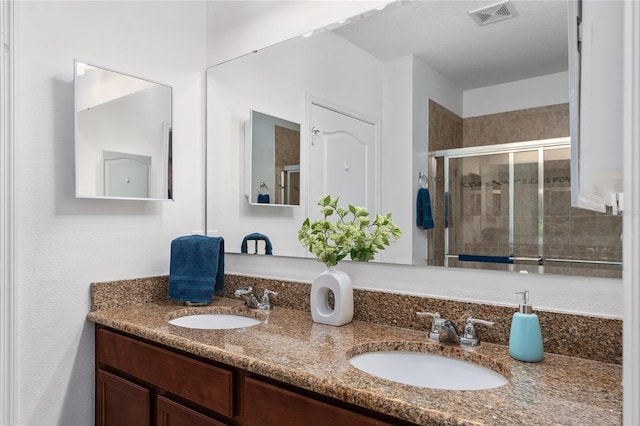 26822 Bull Run, Leesburg, FL 34748 - bathroom featuring double vanity and a stall shower