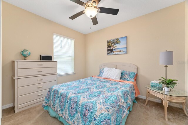 26822 Bull Run, Leesburg, FL 34748 - bedroom featuring light carpet, baseboards, and ceiling fan