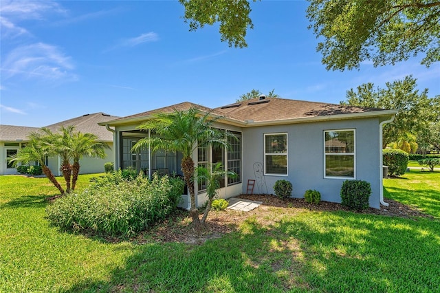 26822 Bull Run, Leesburg, FL 34748 - view of front of house with a sunroom, a front lawn, and stucco siding