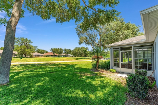 26822 Bull Run, Leesburg, FL 34748 - view of grassy yard featuring a sunroom