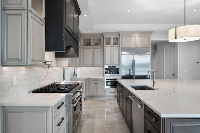 10122 Royal Island Ct, Orlando, FL 32836 - kitchen with high end appliances, a sink, decorative backsplash, premium range hood, and a center island with sink