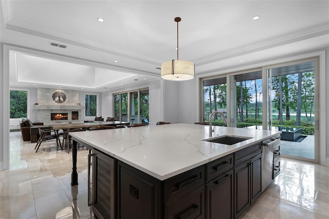 10122 Royal Island Ct, Orlando, FL 32836 - kitchen featuring a raised ceiling, a sink, wine cooler, open floor plan, and recessed lighting