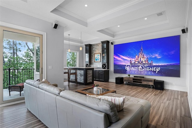 10122 Royal Island Ct, Orlando, FL 32836 - living room featuring a tray ceiling, wood finished floors, a chandelier, crown molding, and recessed lighting