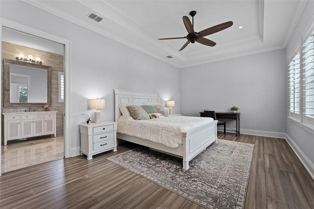 10122 Royal Island Ct, Orlando, FL 32836 - bedroom featuring a tray ceiling, dark wood-style flooring, baseboards, crown molding, and a ceiling fan