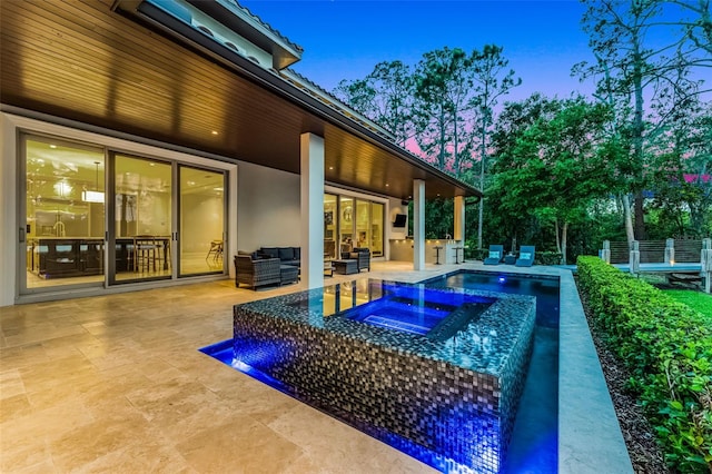 10122 Royal Island Ct, Orlando, FL 32836 - swimming pool featuring an in-ground hot tub, a patio area, and an outdoor living space