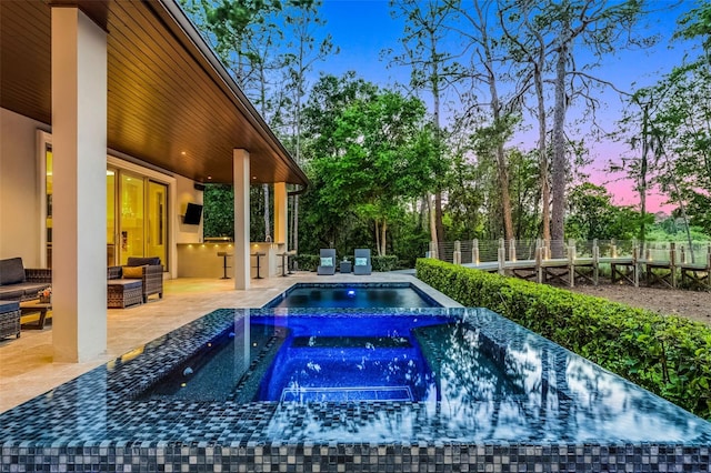 10122 Royal Island Ct, Orlando, FL 32836 - view of pool featuring an in-ground hot tub, an outdoor living space, fence, and a patio area