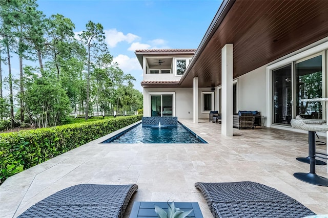 10122 Royal Island Ct, Orlando, FL 32836 - outdoor pool featuring a ceiling fan, an outdoor hangout area, and a patio
