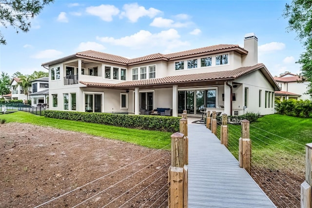 10122 Royal Island Ct, Orlando, FL 32836 - rear view of property with a chimney, stucco siding, and a tile roof
