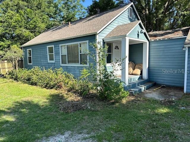 1225 E 1st Ave, Mount Dora, FL 32757 - view of front of house with a shingled roof
