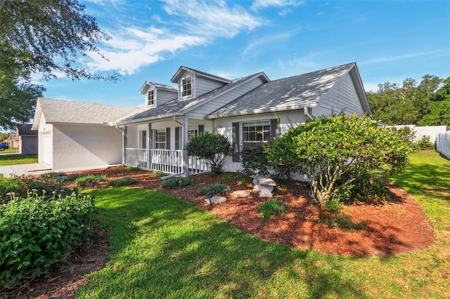 508 Woodview Dr, Tavares, FL 32778 - view of front of house with covered porch and a front lawn