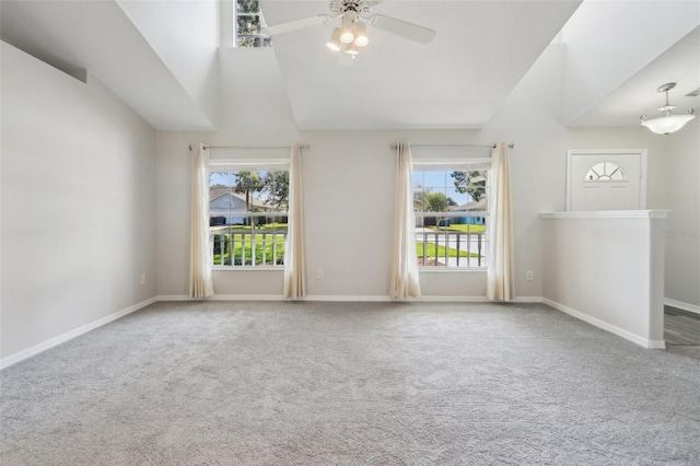 508 Woodview Dr, Tavares, FL 32778 - carpeted empty room featuring healthy amount of natural light, a ceiling fan, high vaulted ceiling, and baseboards
