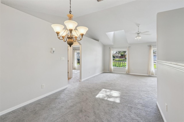 508 Woodview Dr, Tavares, FL 32778 - carpeted empty room with a chandelier, vaulted ceiling, baseboards, arched walkways, and ceiling fan