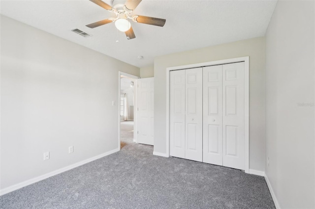 508 Woodview Dr, Tavares, FL 32778 - unfurnished bedroom featuring carpet, baseboards, a closet, and ceiling fan