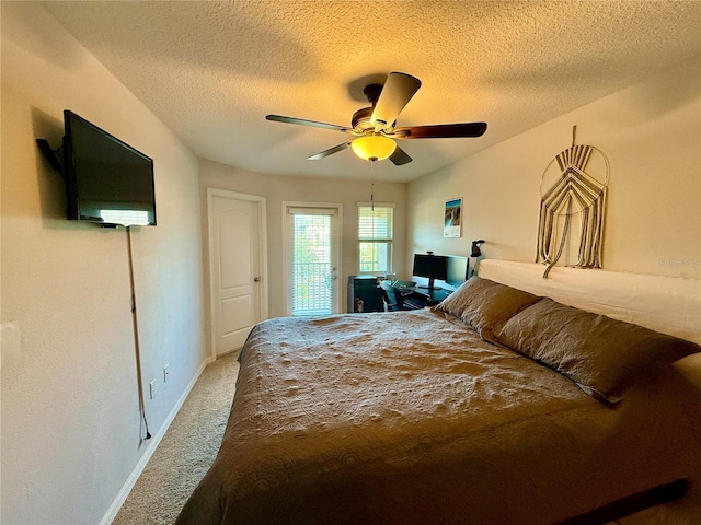 147 Aston Grande Dr, Daytona Beach, FL 32124 - bedroom with carpet flooring, baseboards, a textured ceiling, and ceiling fan