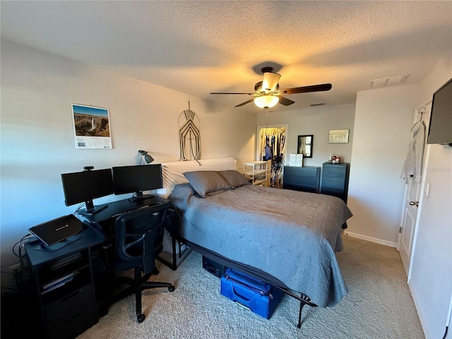 147 Aston Grande Dr, Daytona Beach, FL 32124 - bedroom with carpet floors, a desk, a textured ceiling, a ceiling fan, and baseboards