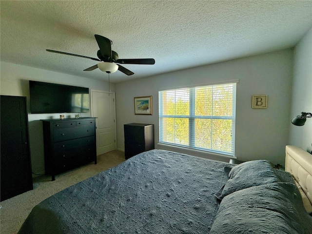 147 Aston Grande Dr, Daytona Beach, FL 32124 - carpeted bedroom featuring a textured ceiling and a ceiling fan