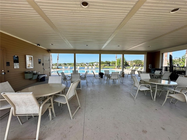 147 Aston Grande Dr, Daytona Beach, FL 32124 - view of patio featuring a community pool and outdoor dining area