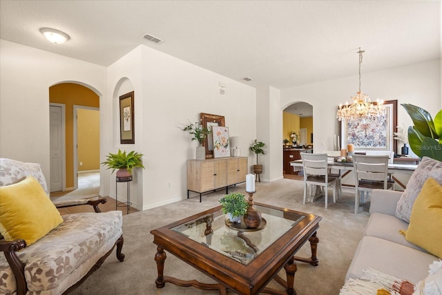 2064 Rafton Rd, Apopka, FL 32703 - living area with arched walkways, a chandelier, and carpet
