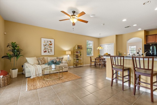 2064 Rafton Rd, Apopka, FL 32703 - living room featuring arched walkways, a ceiling fan, recessed lighting, and light tile patterned floors