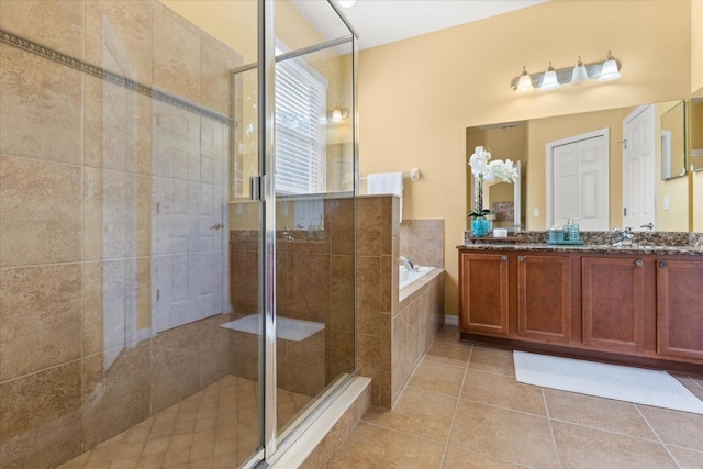 2064 Rafton Rd, Apopka, FL 32703 - bathroom with a garden tub, a stall shower, double vanity, and tile patterned flooring