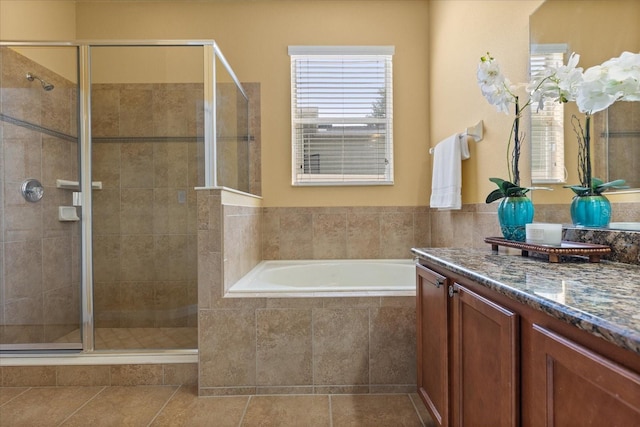 2064 Rafton Rd, Apopka, FL 32703 - bathroom featuring vanity, a bath, a stall shower, and tile patterned floors