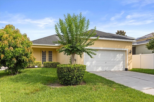 2064 Rafton Rd, Apopka, FL 32703 - ranch-style home with stucco siding, driveway, a garage, french doors, and roof with shingles