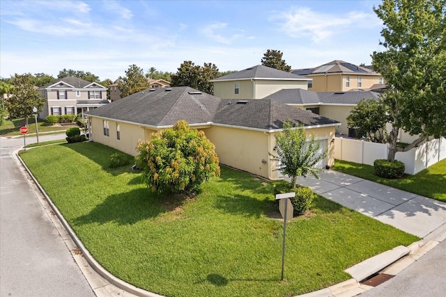 2064 Rafton Rd, Apopka, FL 32703 - view of front of property with driveway, a garage, a residential view, stucco siding, and roof with shingles