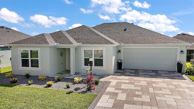 1627 Mclucas Ln, The Villages, FL 34762 - ranch-style home featuring stucco siding, a garage, and a front lawn