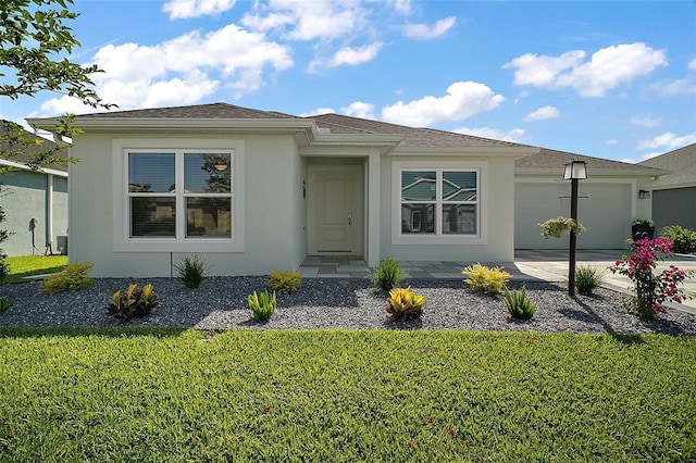 1627 Mclucas Ln, The Villages, FL 34762 - view of front facade featuring an attached garage, stucco siding, a front yard, and concrete driveway