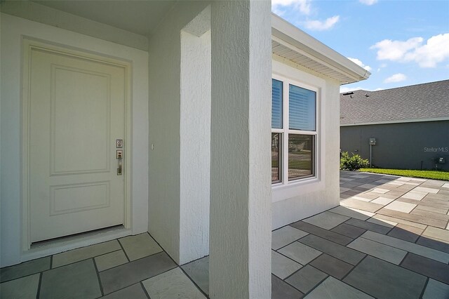 1627 Mclucas Ln, The Villages, FL 34762 - property entrance featuring a patio area