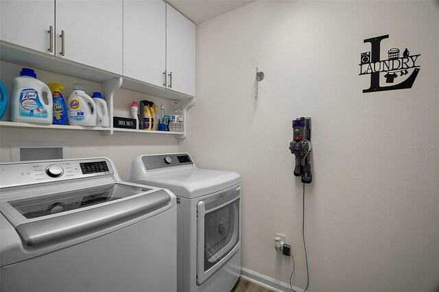 1627 Mclucas Ln, The Villages, FL 34762 - laundry area featuring cabinet space and washer and dryer