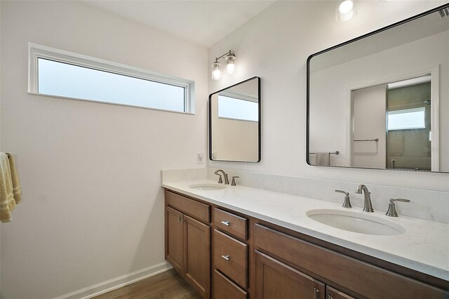 1627 Mclucas Ln, The Villages, FL 34762 - full bath featuring double vanity, wood finished floors, and baseboards