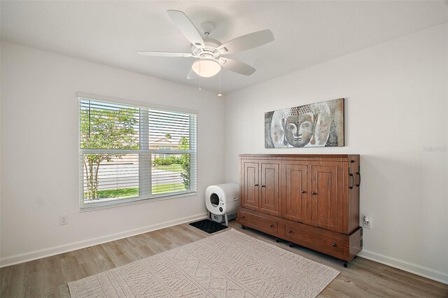 1627 Mclucas Ln, The Villages, FL 34762 - bedroom featuring light wood finished floors, baseboards, and a ceiling fan