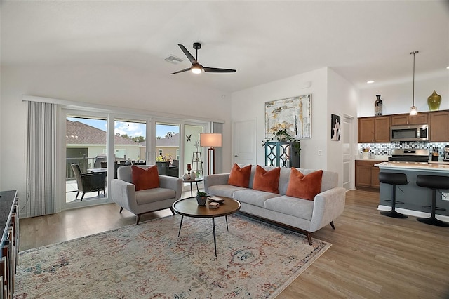 1627 Mclucas Ln, The Villages, FL 34762 - living room featuring a ceiling fan, light wood finished floors, lofted ceiling, and recessed lighting