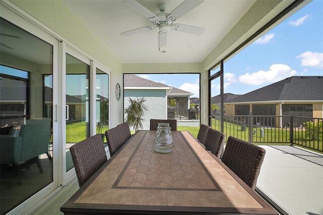 1627 Mclucas Ln, The Villages, FL 34762 - sunroom with a ceiling fan and outdoor dining space