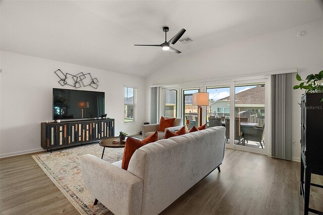 1627 Mclucas Ln, The Villages, FL 34762 - living area with a ceiling fan, wood finished floors, lofted ceiling, and baseboards