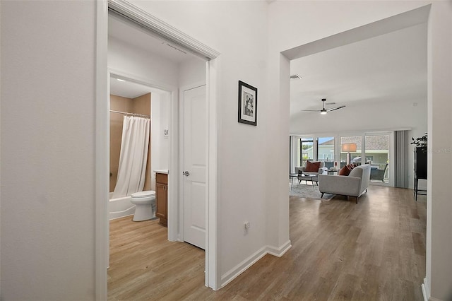 1627 Mclucas Ln, The Villages, FL 34762 - corridor featuring light wood-style floors and baseboards
