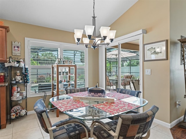 2998 Kramer Ct, The Villages, FL 32163 - dining room featuring a chandelier, light tile patterned flooring, baseboards, and vaulted ceiling