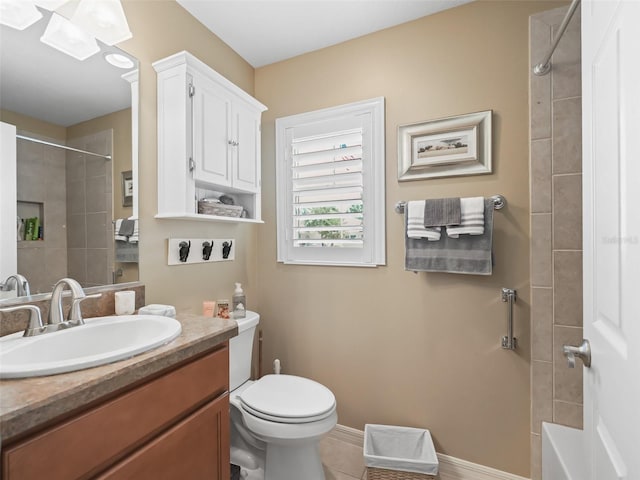 2998 Kramer Ct, The Villages, FL 32163 - bathroom with vanity, toilet, baseboards, tile patterned floors, and a skylight