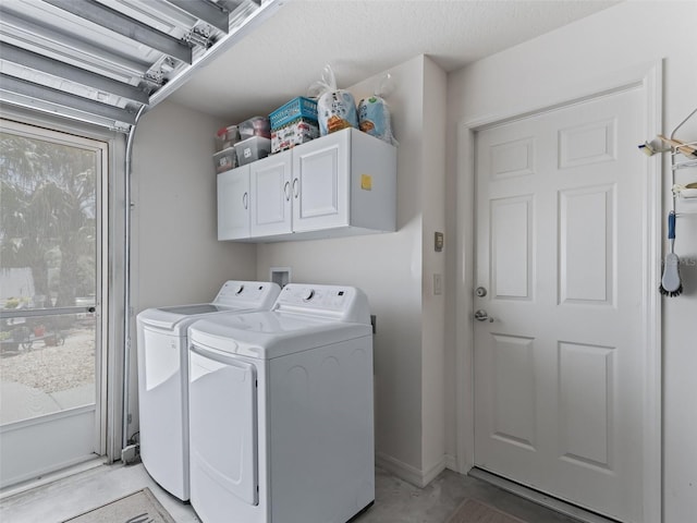 2998 Kramer Ct, The Villages, FL 32163 - laundry area with cabinet space and washer and clothes dryer
