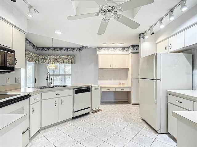 6147 N Whispering Oak Loop, Beverly Hills, FL 34465 - kitchen featuring track lighting, white appliances, a sink, light countertops, and light tile patterned floors