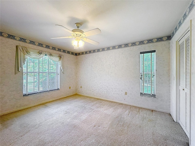 6147 N Whispering Oak Loop, Beverly Hills, FL 34465 - unfurnished bedroom with carpet flooring, a closet, and a ceiling fan