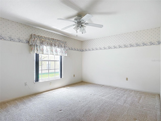 6147 N Whispering Oak Loop, Beverly Hills, FL 34465 - empty room with carpet flooring, a ceiling fan, and wallpapered walls